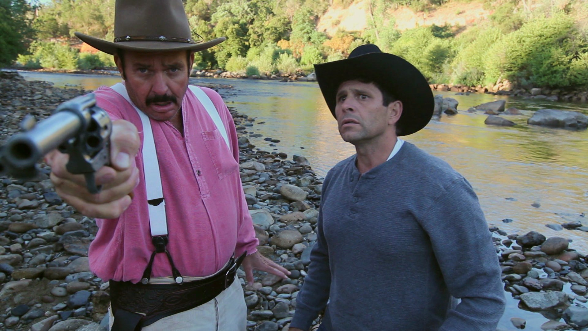 Rob Tillitz as Henry pointing a six shooter and Bill Bettencourt as Arlen with a concerned look in THE GOLdEN TREE (2010).